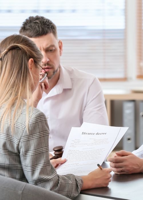 Serious employer and HR manager talking to job candidate at interview